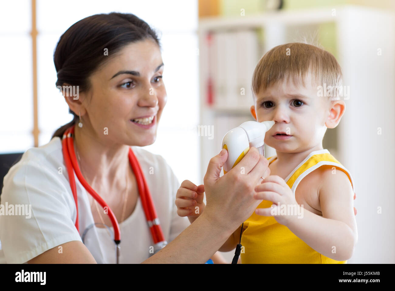 Doctor and kid runny nose Stock Photo