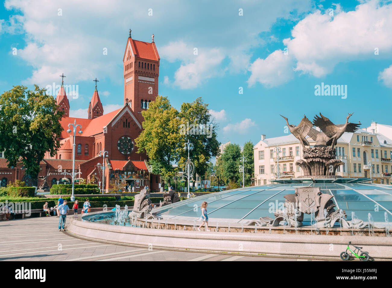 Minsk, Belarus. Glass Dome With Storks Sculpture At Top Of Stolica Stolitsa, Underground Shopping Center At The Independence Square And Catholic Red C Stock Photo