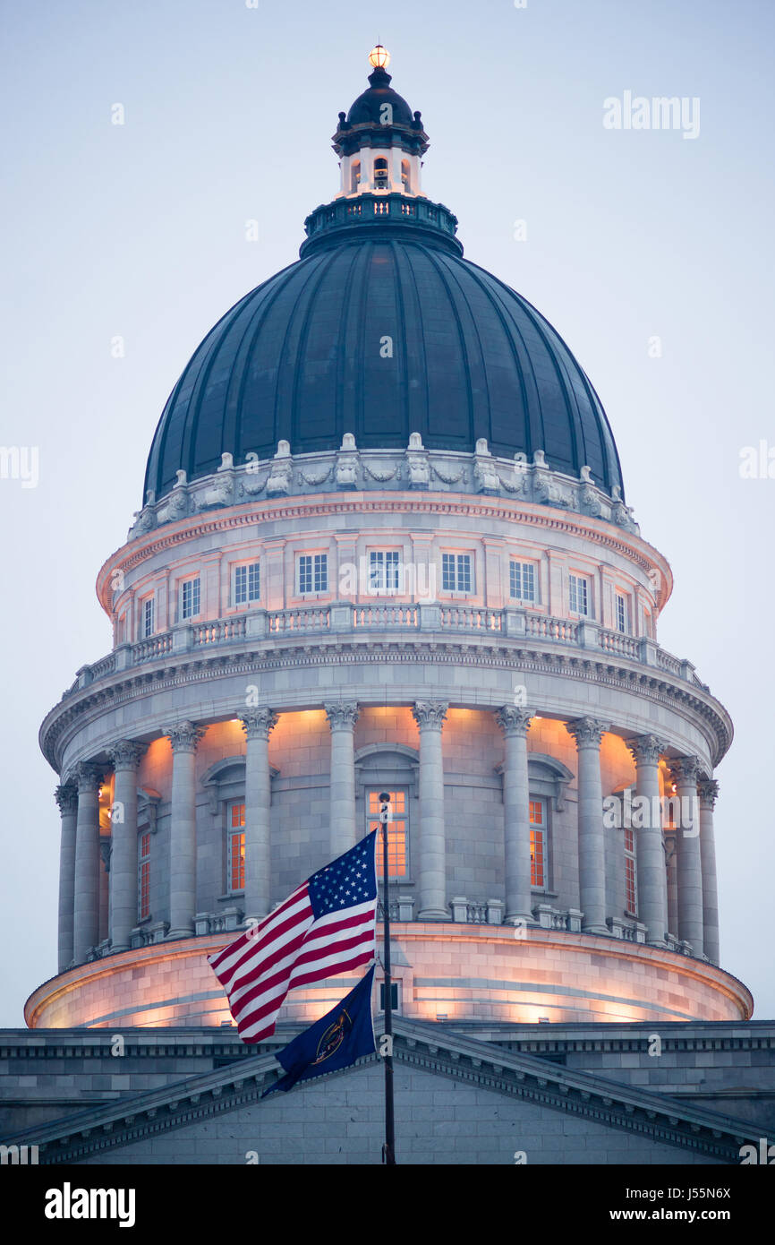 The US and Utah Flags fly in front of the State Capital in Salt Lake City Stock Photo