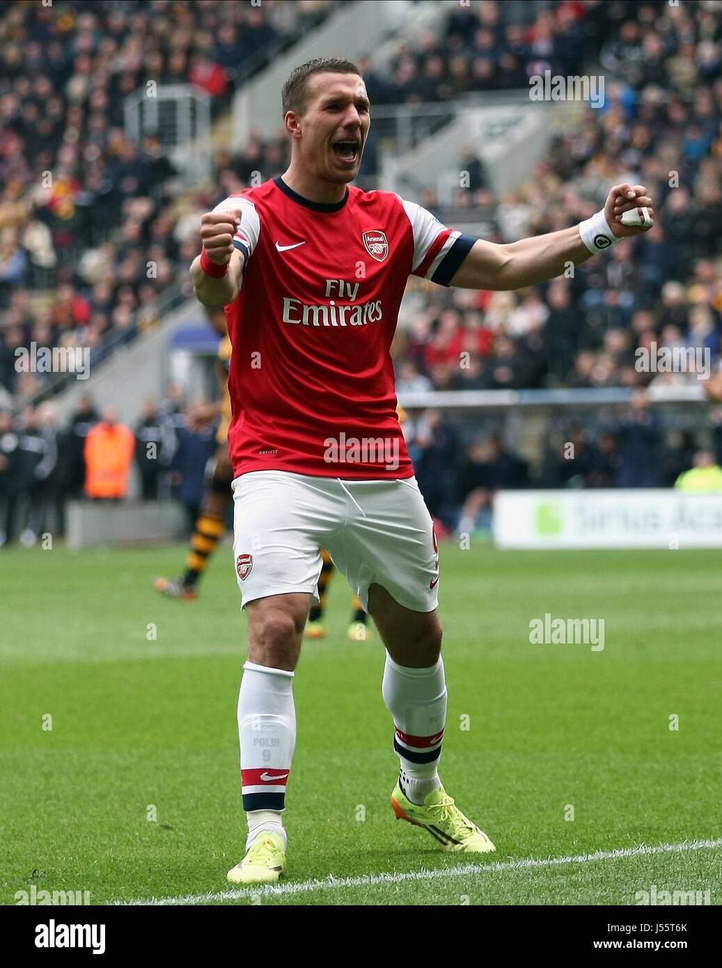 LUKAS PODOLSKI CELEBRATES MAKI HULL CITY V ARSENAL KC STADIUM HULL ENGLAND 20 April 2014 Stock Photo