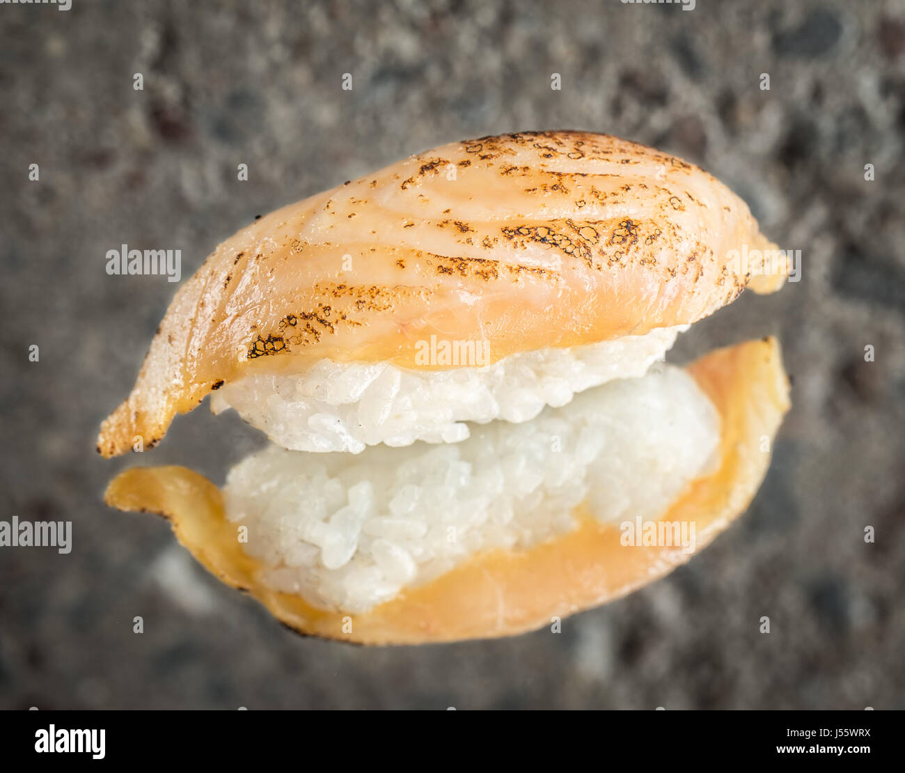 Burned nigiri sushi with sea bass Stock Photo Alamy