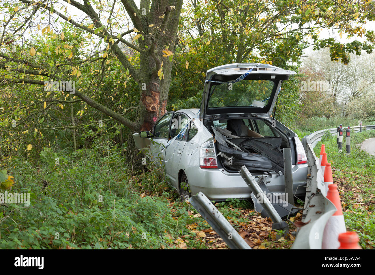 Silver Toyota Prius road traffic accident car crash into a tree Stock Photo