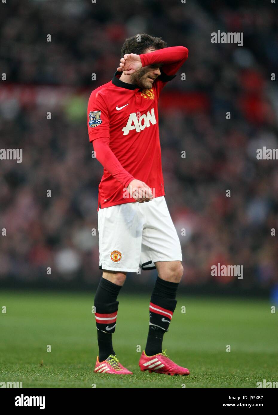 DEJECTED JUAN MATA MANCHESTER UNITED V FULHAM OLD TRAFFORD MANCHESTER ENGLAND 09 February 2014 Stock Photo