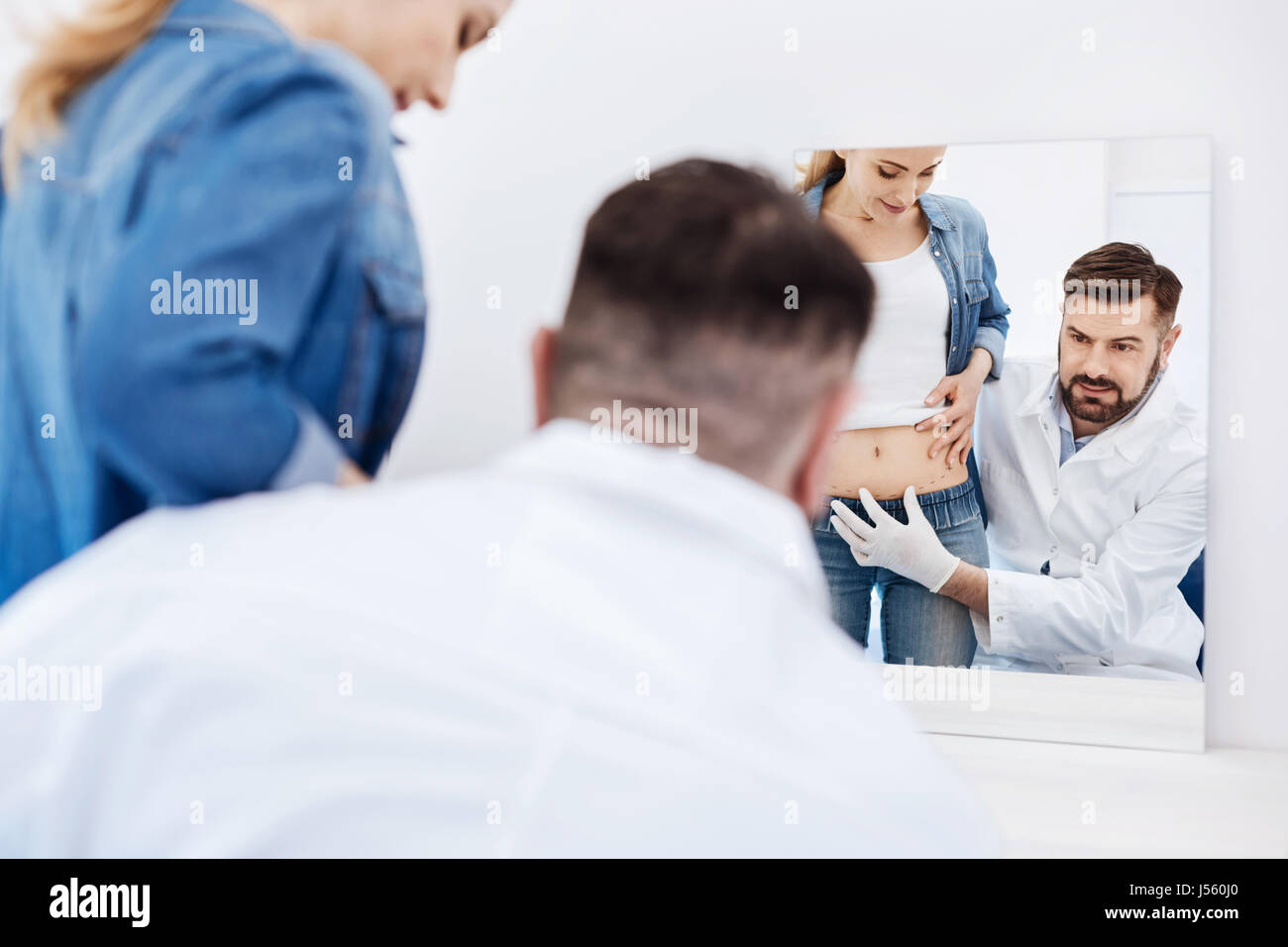 Professional handsome doctor looking into the mirror Stock Photo Alamy