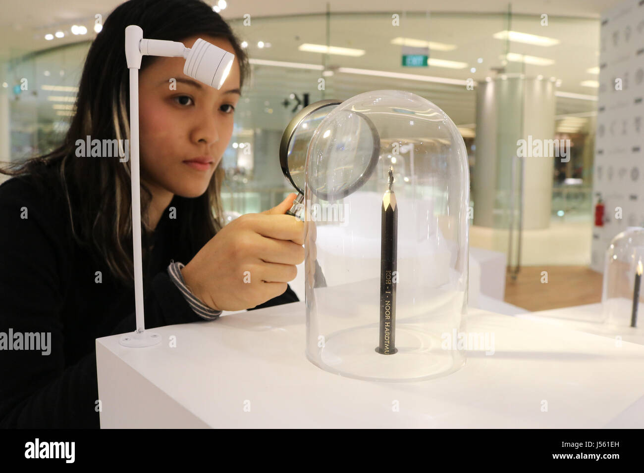 Singapore. 16th May 2017. A visitor uses a magnifying glass to view The