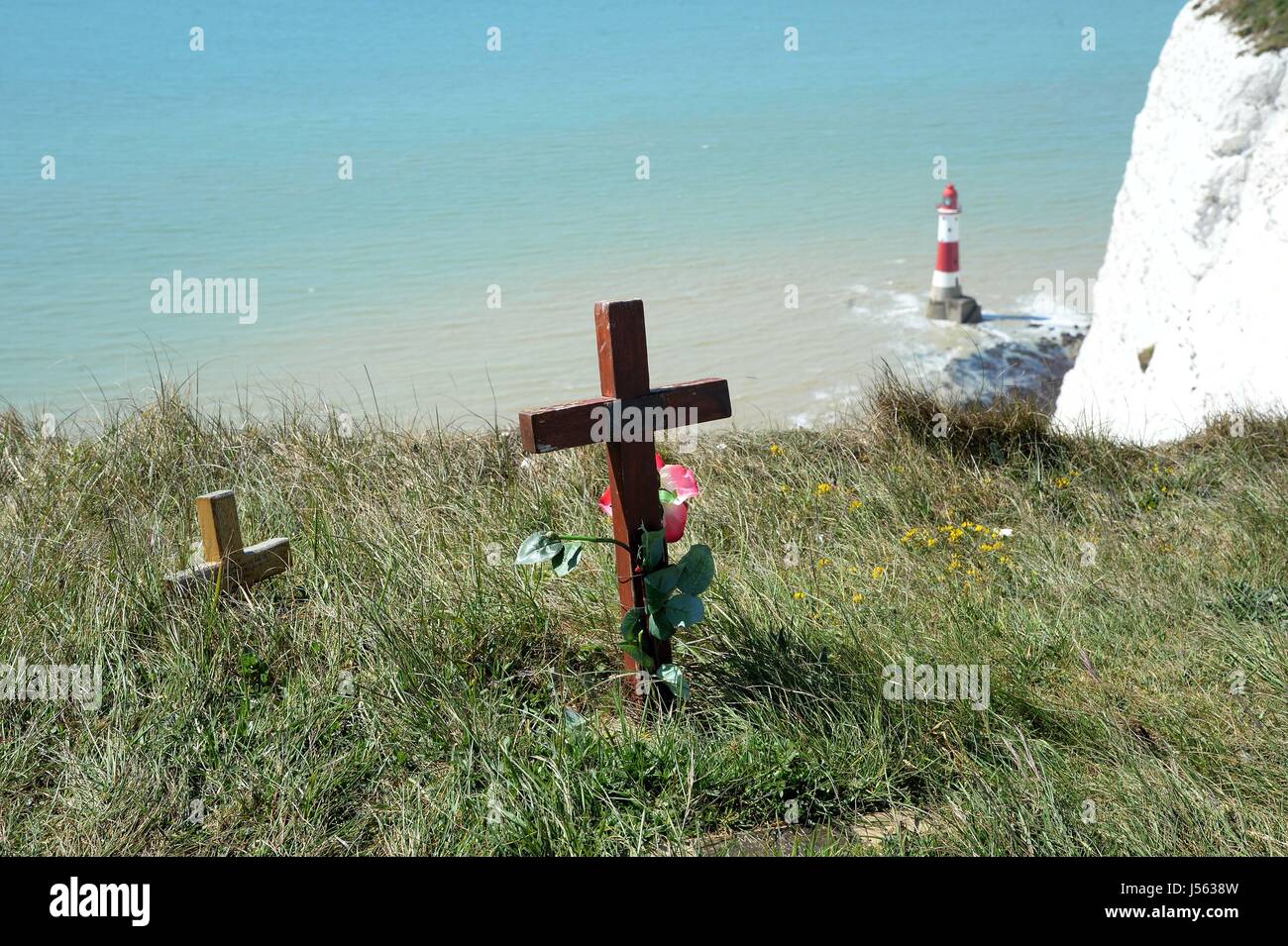 Cross and memorials to suicide victims at Beachy Head, East Sussex, UK Stock Photo