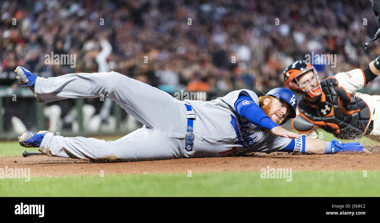 San Francisco, California, USA. 16th May, 2017. Los Angeles Dodgers third baseman Justin Turner (10) sliding past San Francisco Giants catcher Buster Posey (28), only to be tagged out in the third inning of a MLB baseball game between the Los Angeles Dodgers and the San Francisco Giants at AT&T Park in San Francisco, California. Valerie Shoaps/CSM/Alamy Live News Stock Photo