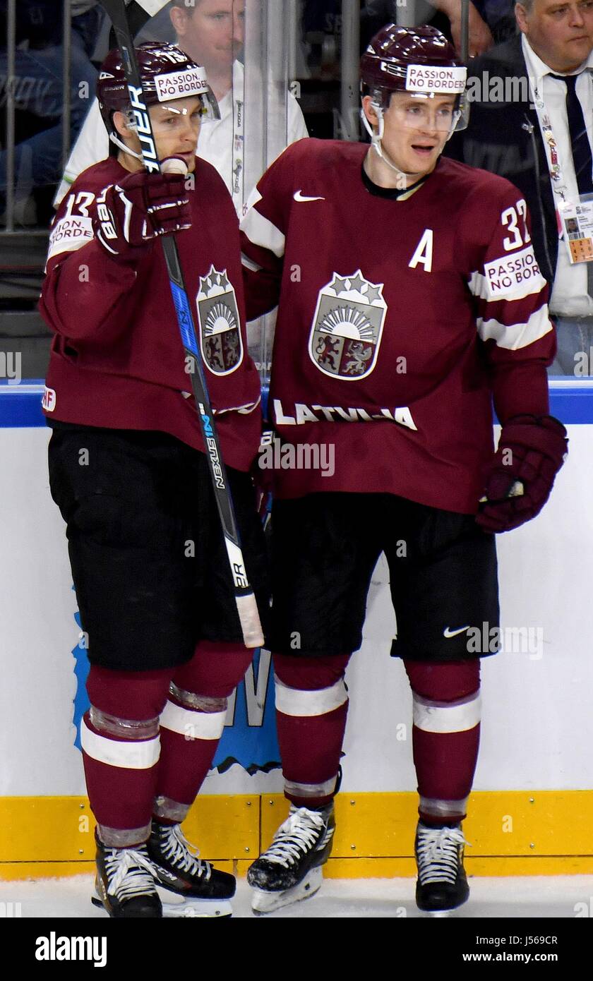 Latvia's Gunars Skvorcovs (L) celebrates with teammate Arturs Kulda. after  giving his side a 2:1 lead during the Ice Hockey Wold Championship match  between Germany and Latvia in the Lanxess Arena in