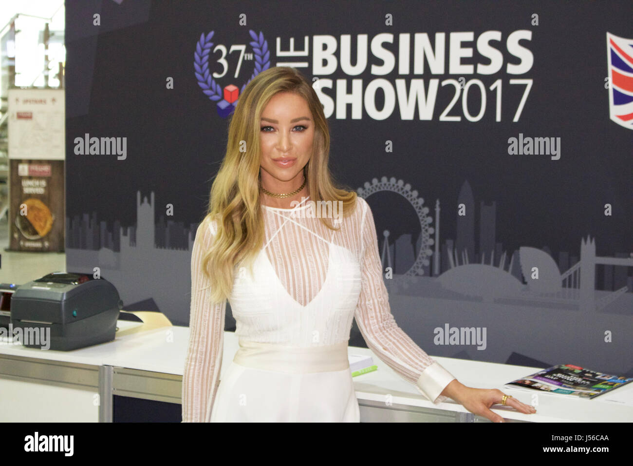 London, UK. 17th May, 2017. Lauren Pope arriving at the Business Show 2017 at Excel Exhibition Centre London where she appears as A keynote speaker. Dressed in a white jumpsuit with mesh detail and split flared legs. As well as a TV star DJ and Model Lauren is a keen entrepreneur who runs her own hair extension business. Credit: Ayeesha Walsh/Alamy Live News Stock Photo
