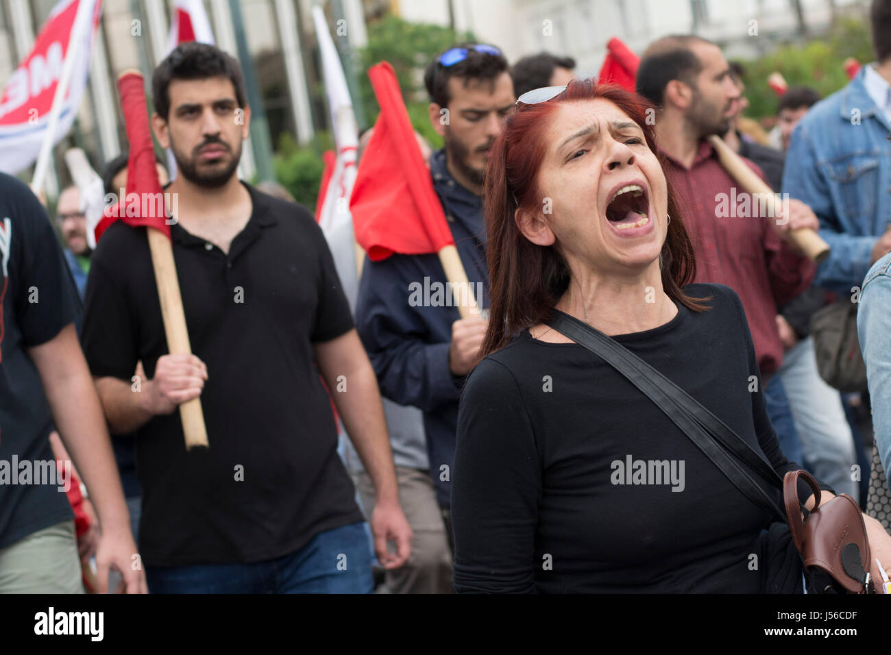 Athens, Greece. 17th May, 2017. Strikers march holding banners and shouting slogans against the government and further upcoming austerity measures. Thousands took to the streets participating in a 24 hour general strike organized by private and public sector unions, protesting against the recent fiscal deal between the government and the country’s creditors. © Nikolas Georgiou / Alamy Live News Stock Photo