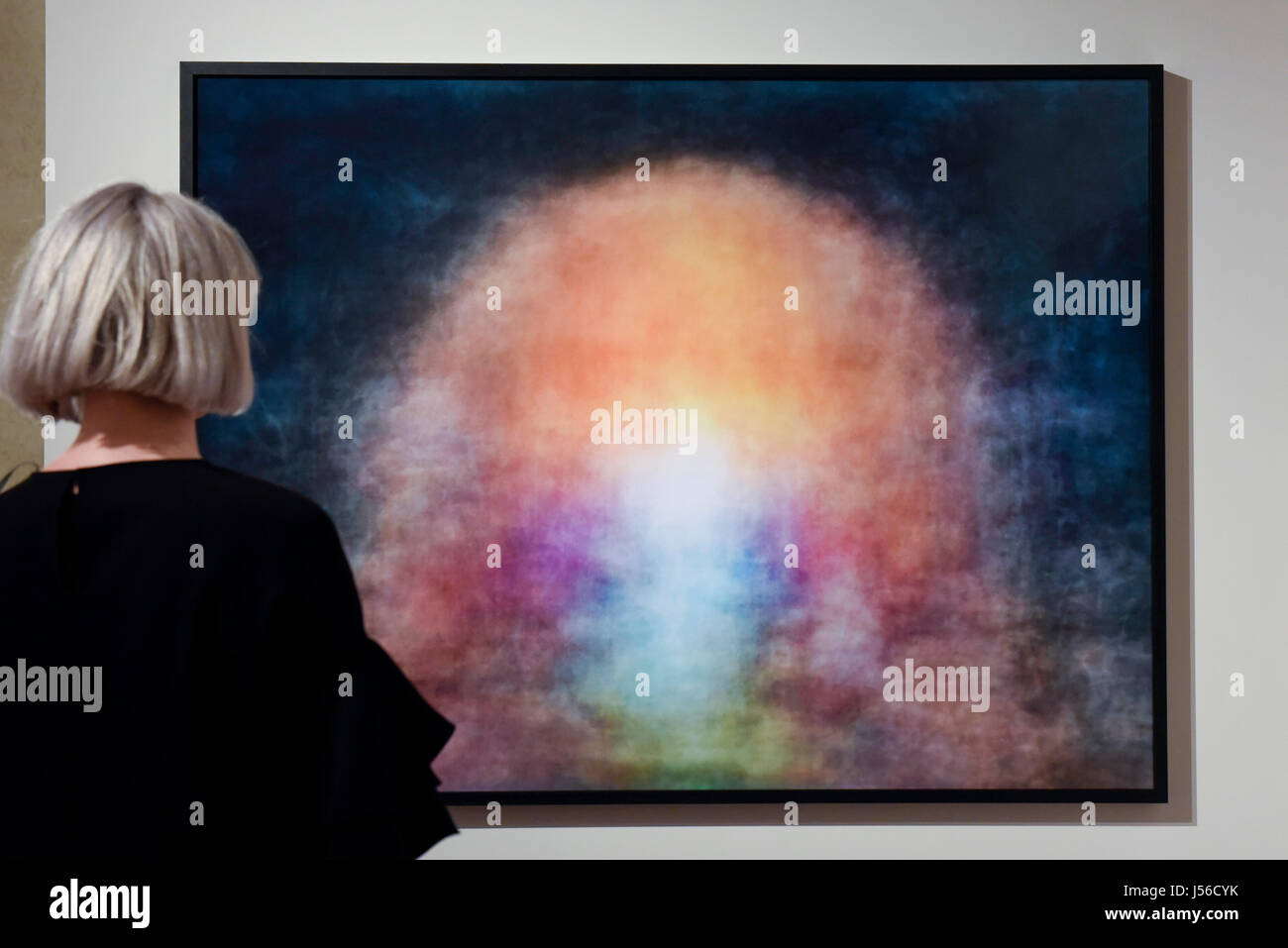 London, UK.  17 May 2017. A visitor views 'Alice in Wonderland, 1951', 2017 by Jason Shulman. Each image is a long exposure of the Hollywood film.  Preview of Photo London 2017 at Somerset House.  Now in its third edition, the event showcases the best in contemporary photography from 89 galleries from 16 different countries for collectors and enthusiasts. The show opens 18-21 May 2017.  Credit: Stephen Chung / Alamy Live News Stock Photo