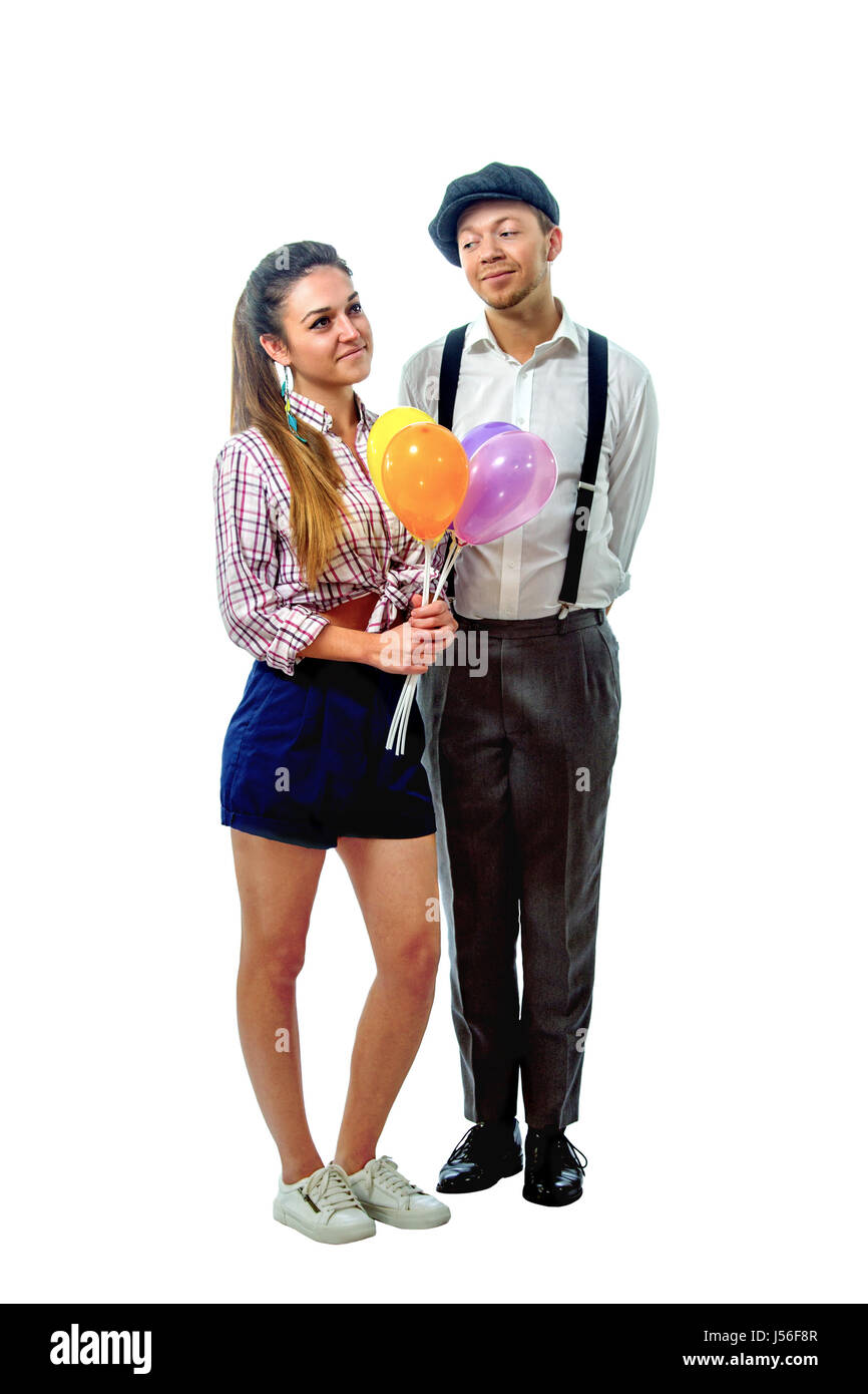 image of a young man in a cap gave the girl balloons Stock Photo