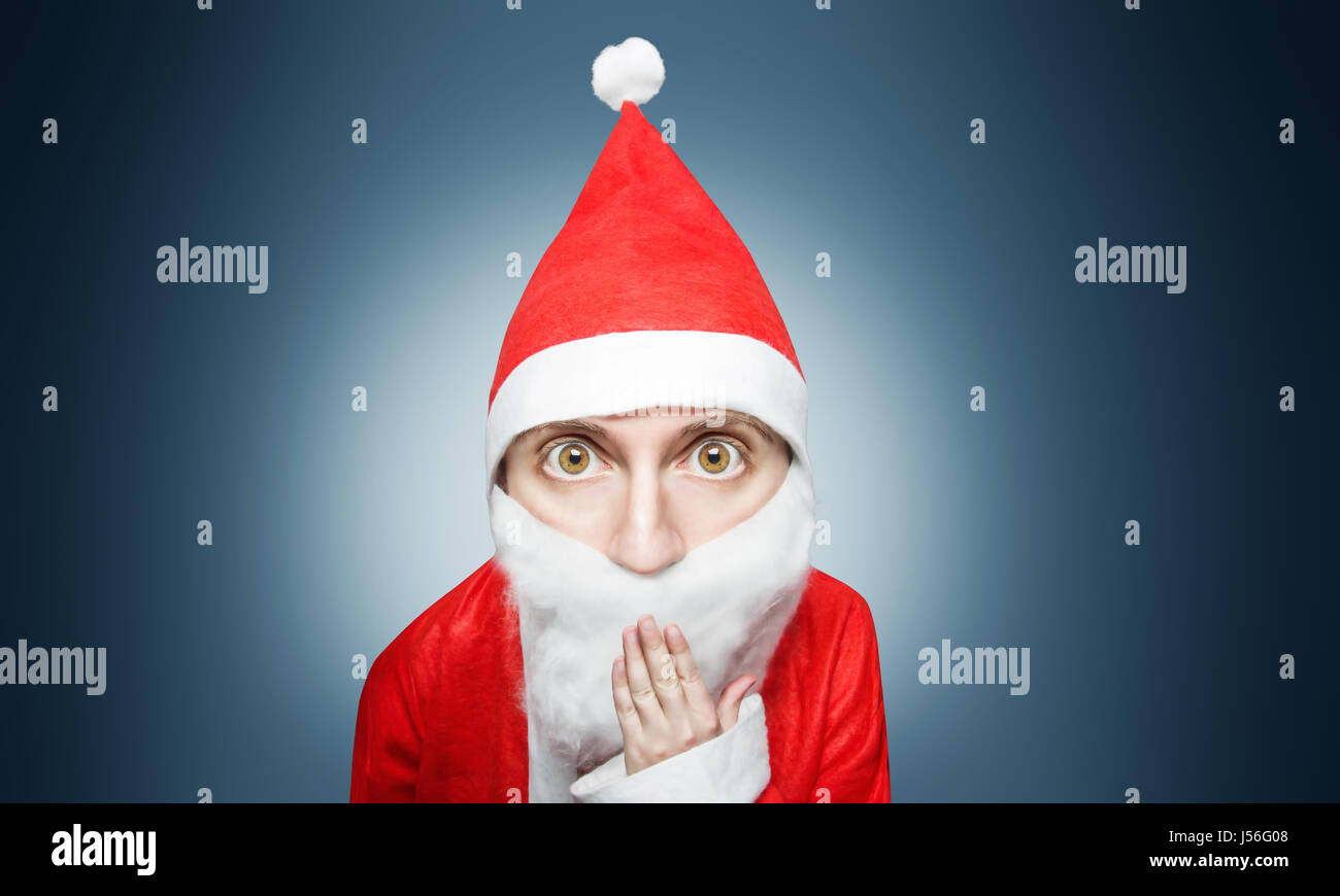 caricature of surprised santa claus comic figure with hand over mouth Stock Photo