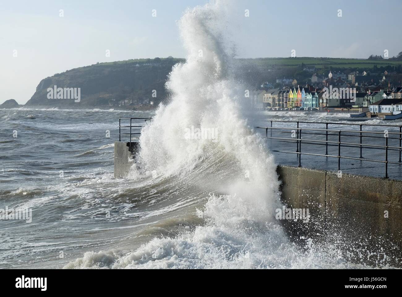 Wave breaking on pier at Whitehead, Northern Ireland Stock Photo