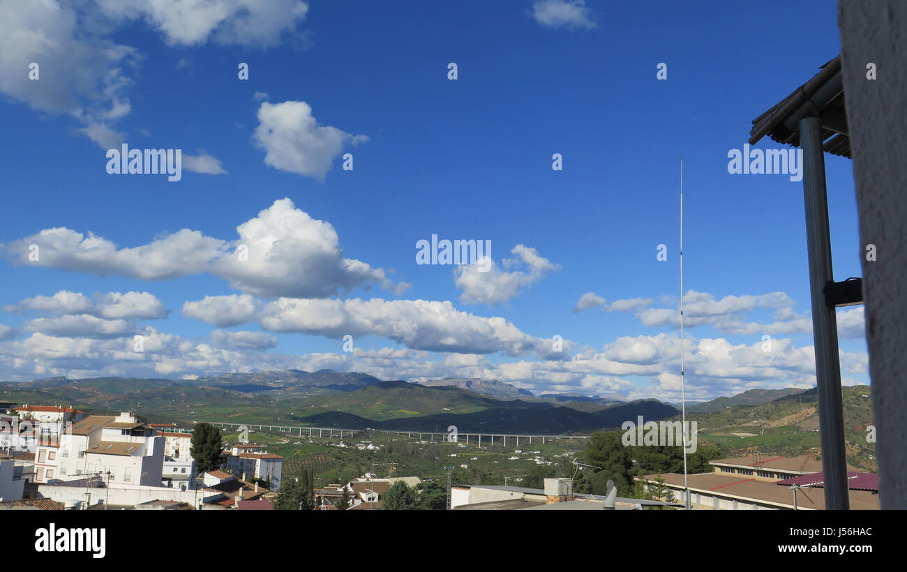 View of El Torcal mountain on sunny day with large clouds over valley Stock Photo