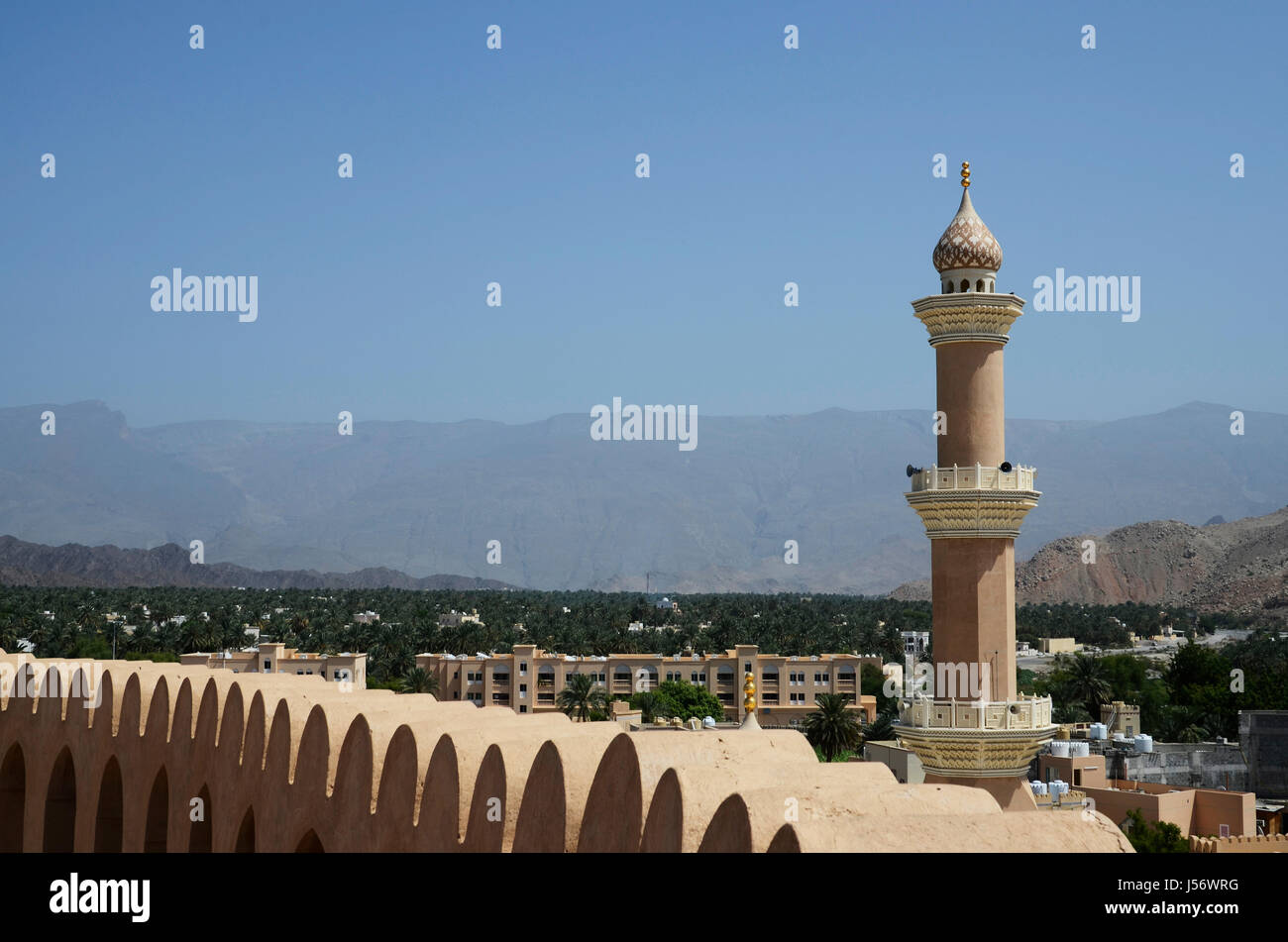 View from the walls of Nizwa Fort at the minaret of a nearby mosque, Nizwa, Sultanate of Oman Stock Photo