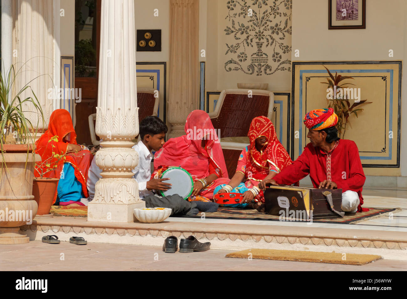 Ranthambore, India - February 7, 2015: Local musicians sit rehearsing for a wedding in a hotel in Ranthambore Stock Photo