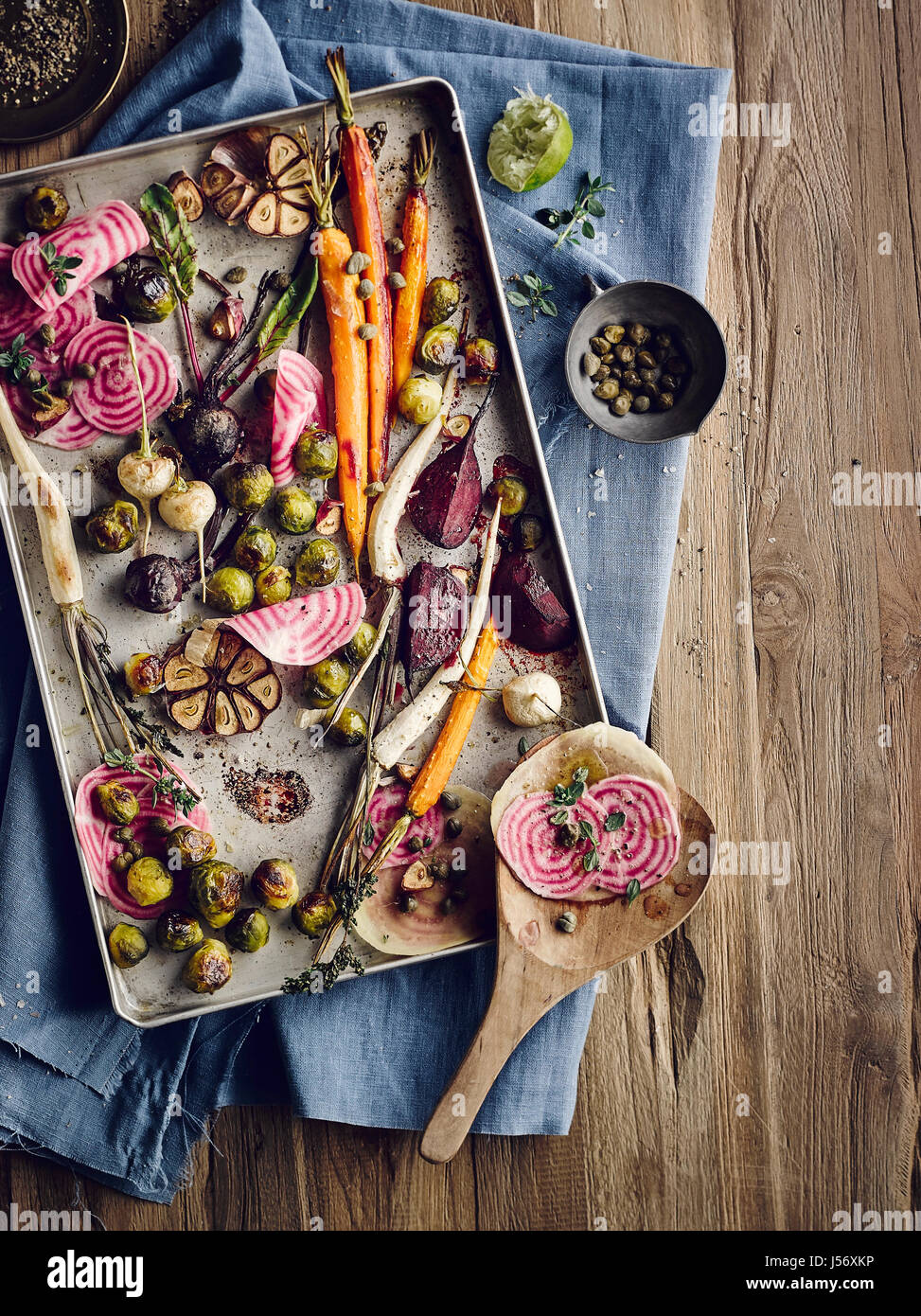 Brussel sprouts and root vegetables with capers from the oven Stock Photo