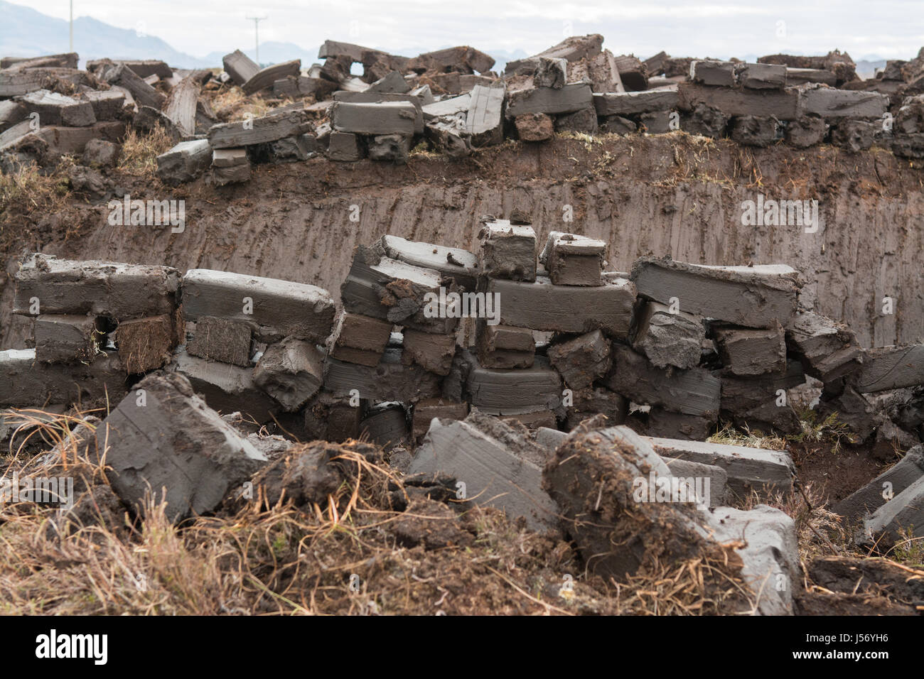 Peat freshly cut by crofter, drying to be used for fuel, Wester Ross, Scotland, UK Stock Photo
