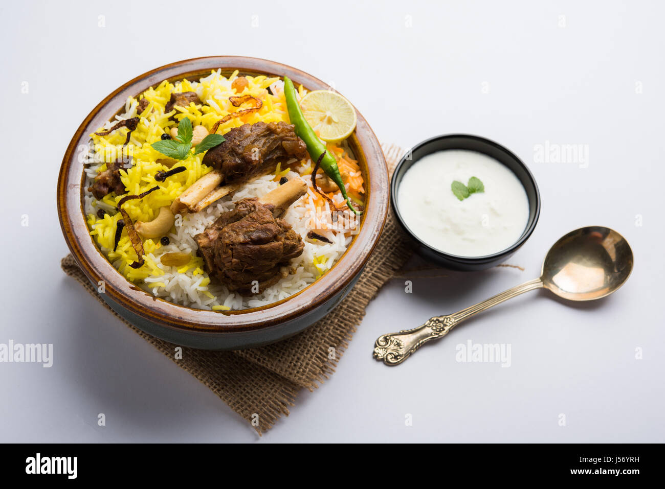 kashmiri Mutton Gosht Biryani / Lamb Biryani / Mutton Biryani served with Yogurt dip, selective