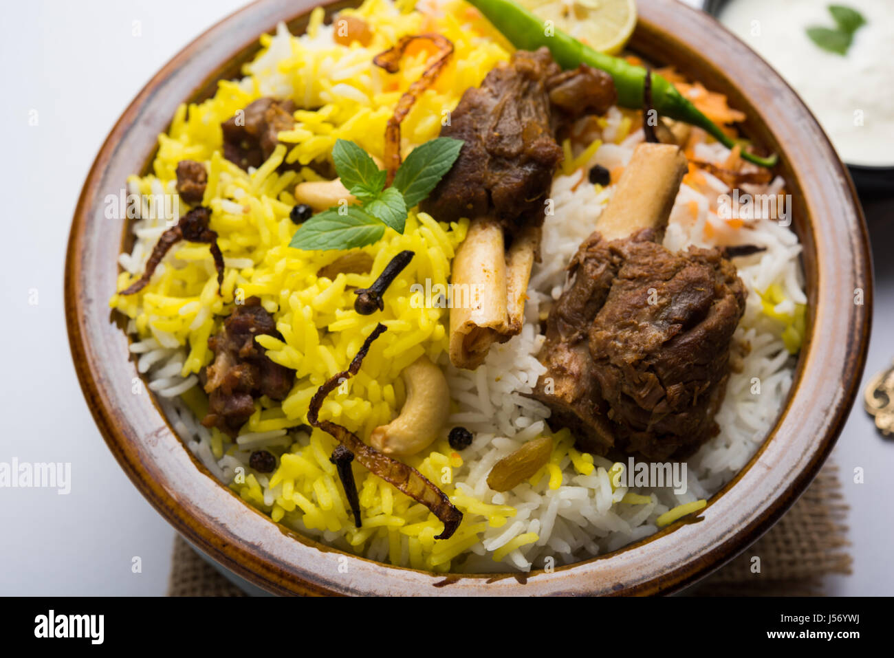 kashmiri Mutton Gosht Biryani / Lamb Biryani / Mutton Biryani served with Yogurt dip, selective