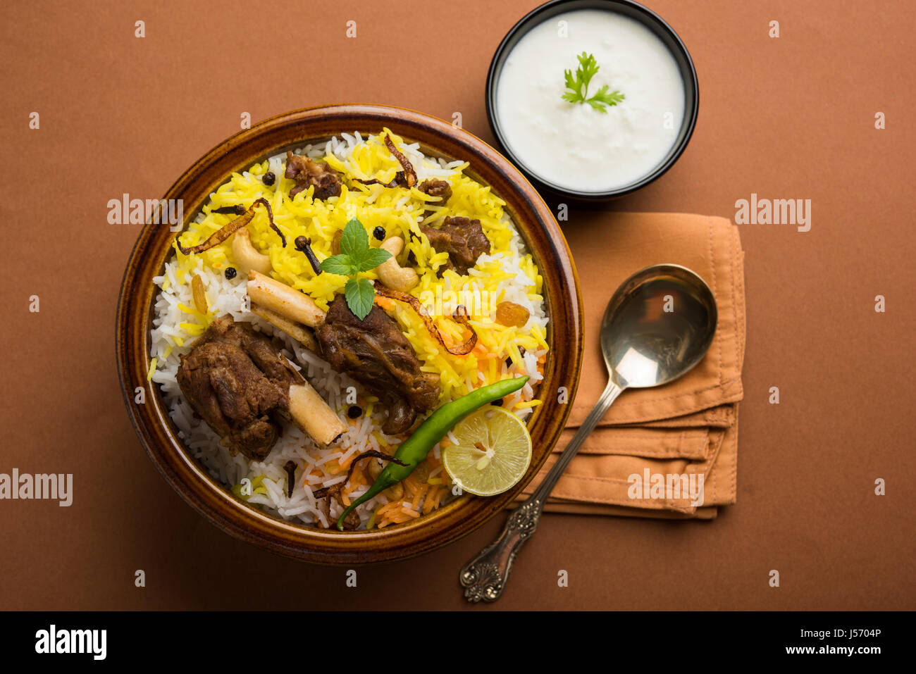kashmiri Mutton Gosht Biryani / Lamb Biryani / Mutton Biryani served with Yogurt dip, selective