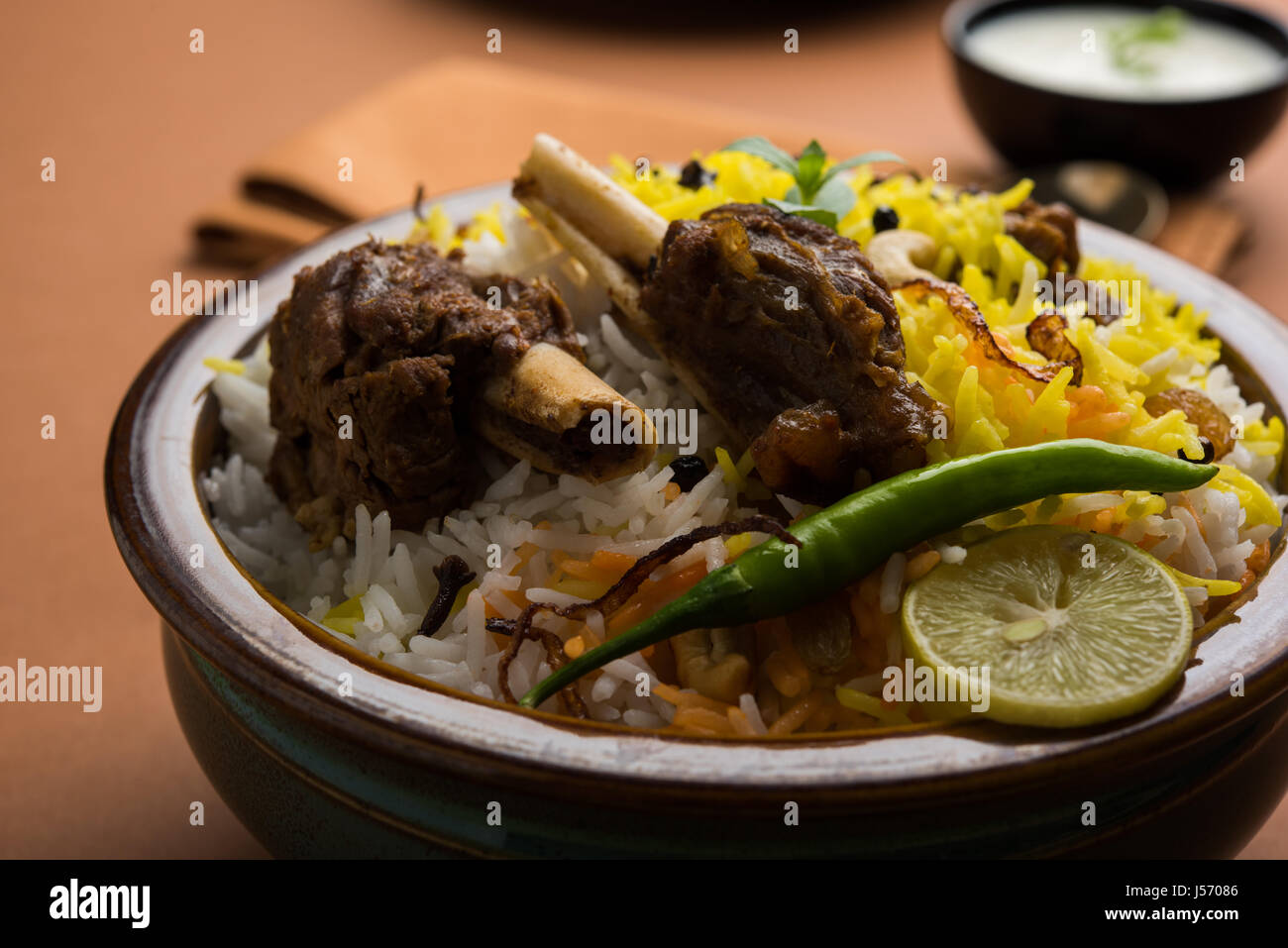 kashmiri Mutton Gosht Biryani / Lamb Biryani / Mutton Biryani served with Yogurt dip, selective