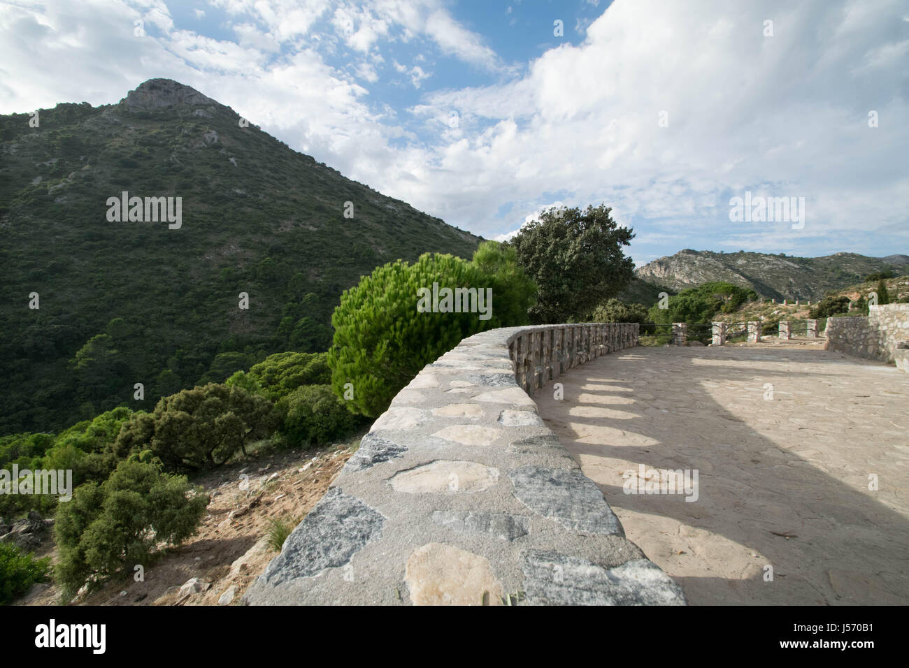 a stone path leading into the mountains in Marbella, Spain Stock Photo