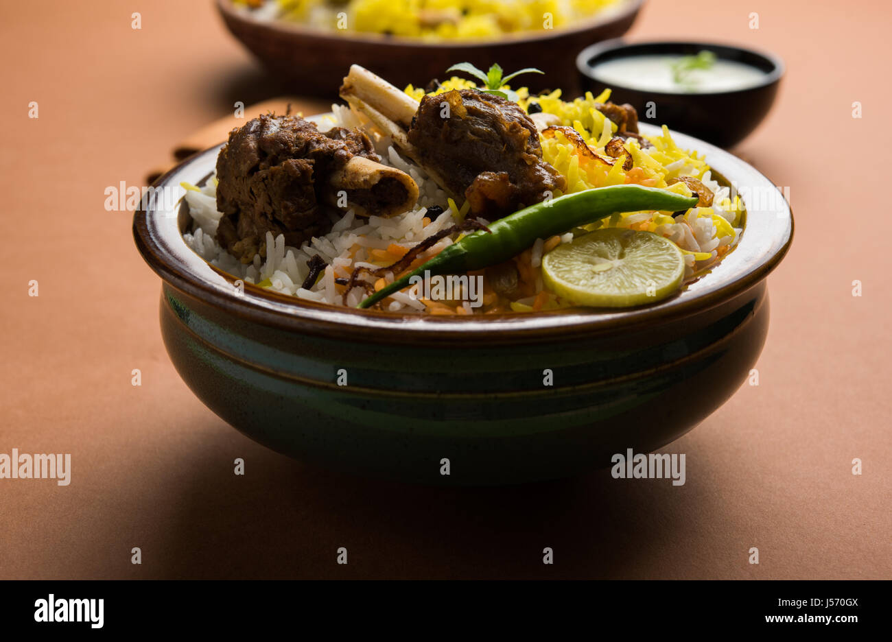 kashmiri Mutton Gosht Biryani / Lamb Biryani / Mutton Biryani served with Yogurt dip, selective