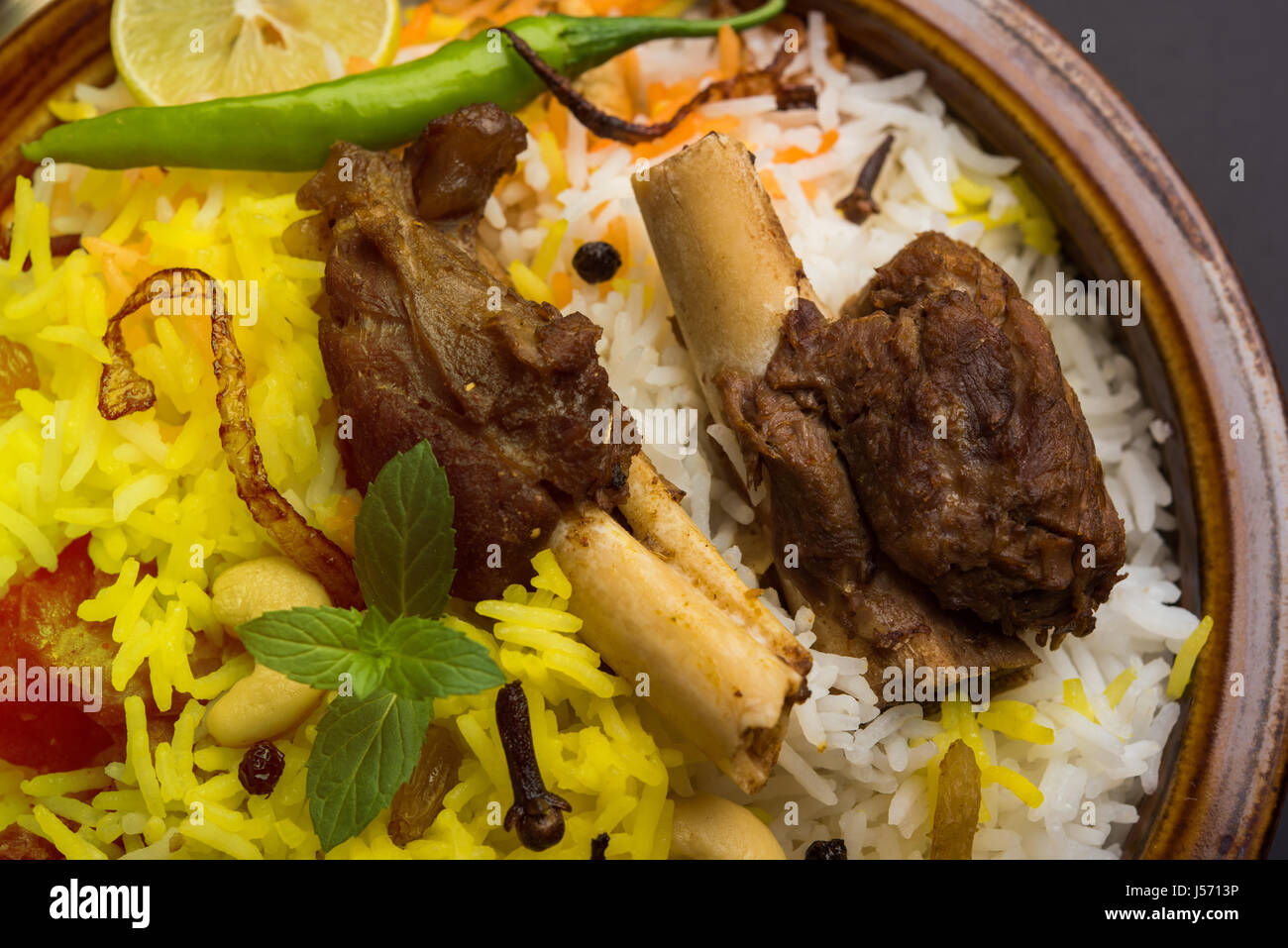 kashmiri Mutton Gosht Biryani / Lamb Biryani / Mutton Biryani served with Yogurt dip, selective focus Stock Photo