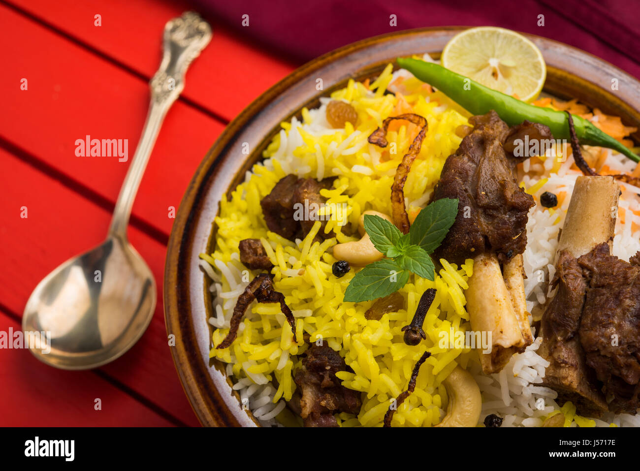 kashmiri Mutton Gosht Biryani / Lamb Biryani / Mutton Biryani served with Yogurt dip, selective