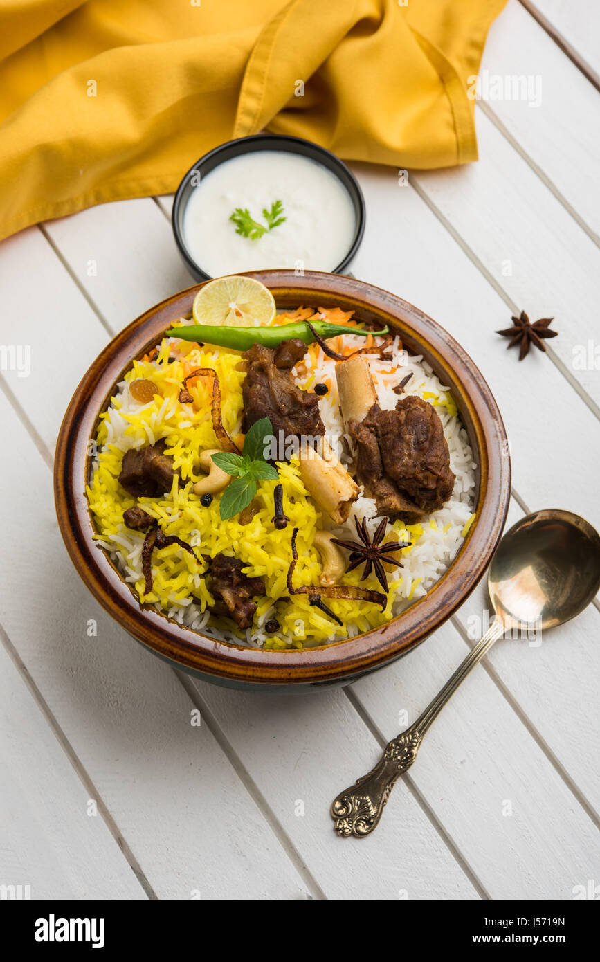 kashmiri Mutton Gosht Biryani / Lamb Biryani / Mutton Biryani served with Yogurt dip, selective