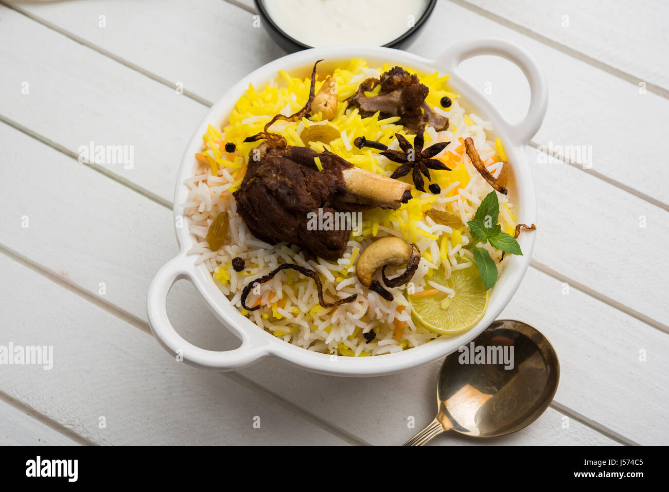 kashmiri Mutton Gosht Biryani / Lamb Biryani / Mutton Biryani served with Yogurt dip, selective