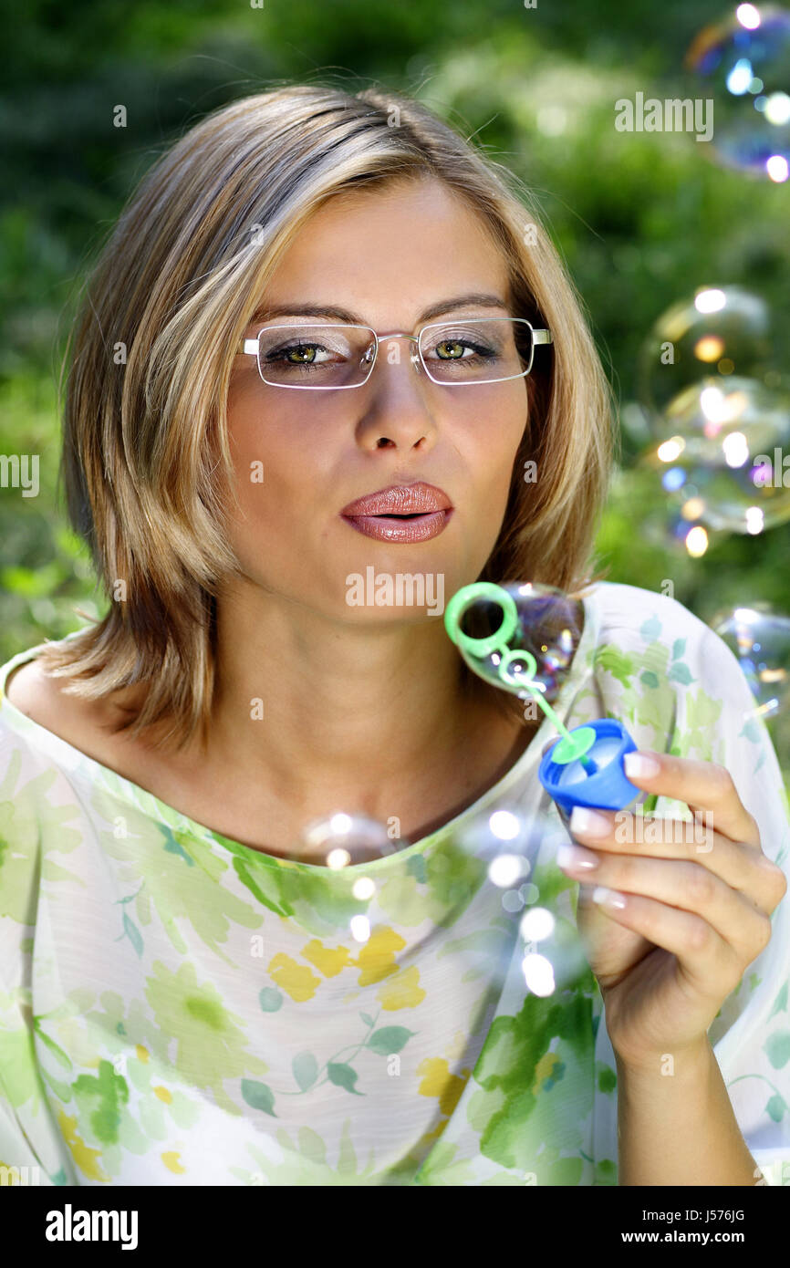 young woman with glasses and bubbles Stock Photo Alamy