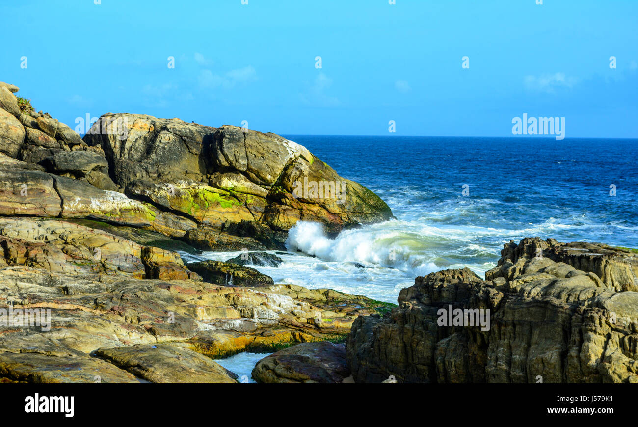 Waves washing ashore over rocks, Indian Ocean Stock Photo - Alamy