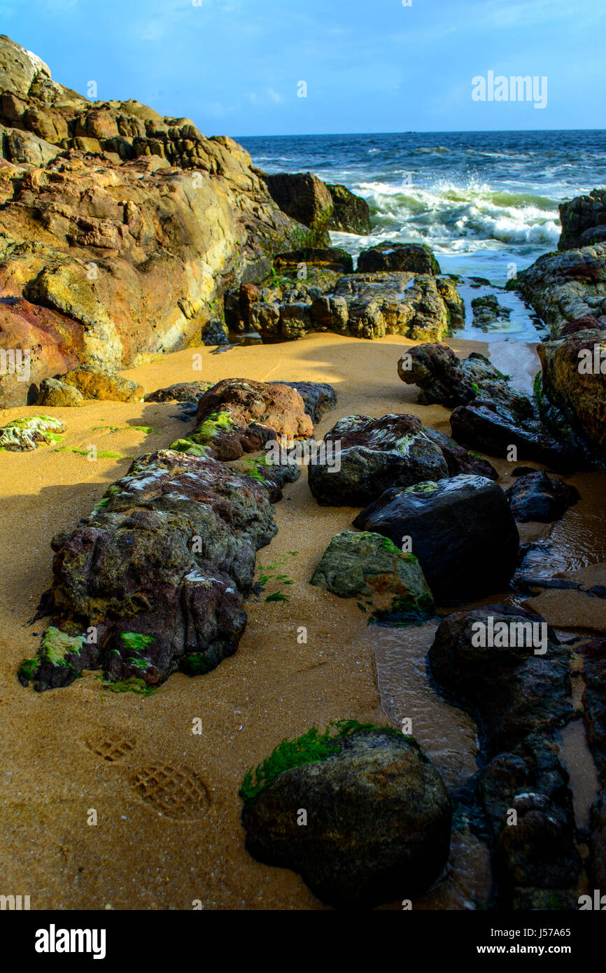 Waves washing ashore over the rocks Stock Photo - Alamy