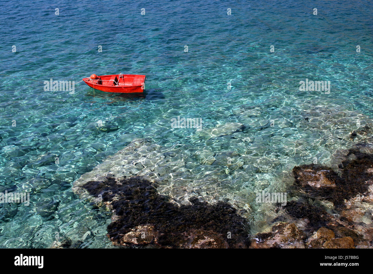 mediterran rowing boat turquoise salt water sea ocean water sailing boat Stock Photo