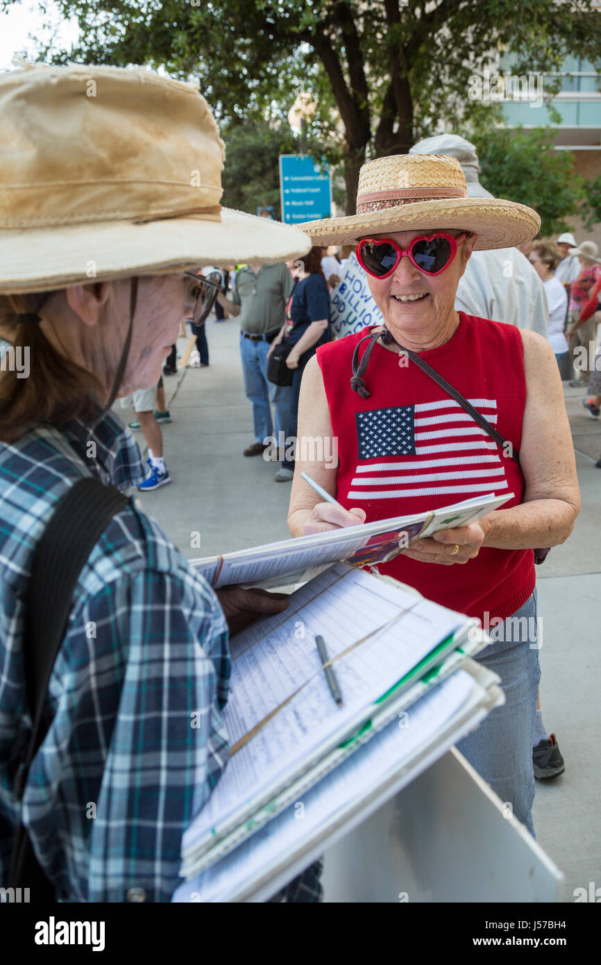 Tucson, Arizona - A woman circulates a petition supporting pre-school programs for kids. Stock Photo
