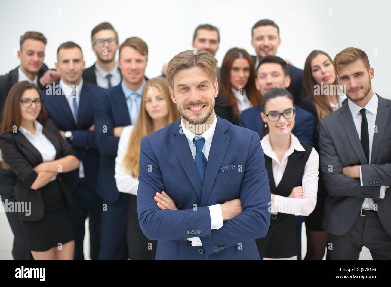 Portrait of smiling business people against white background Stock ...