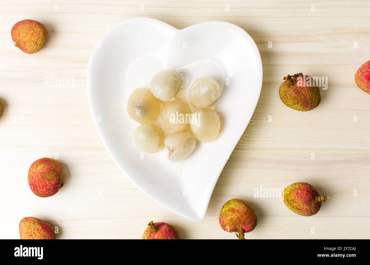 Lychee tropical fruit on a wooden table Stock Photo