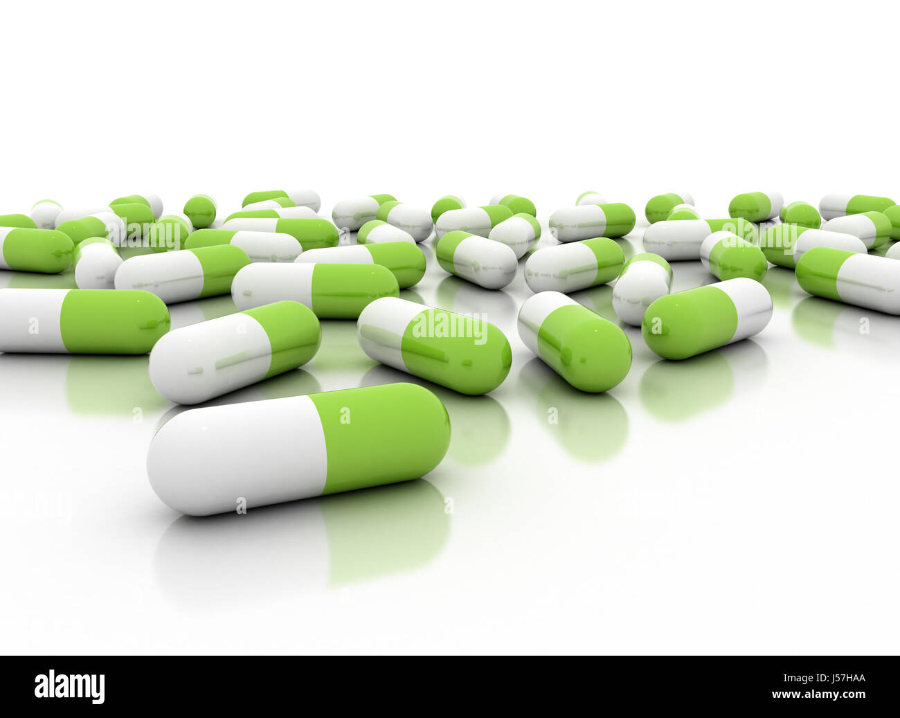 Group of green herbal pills on white background Stock Photo