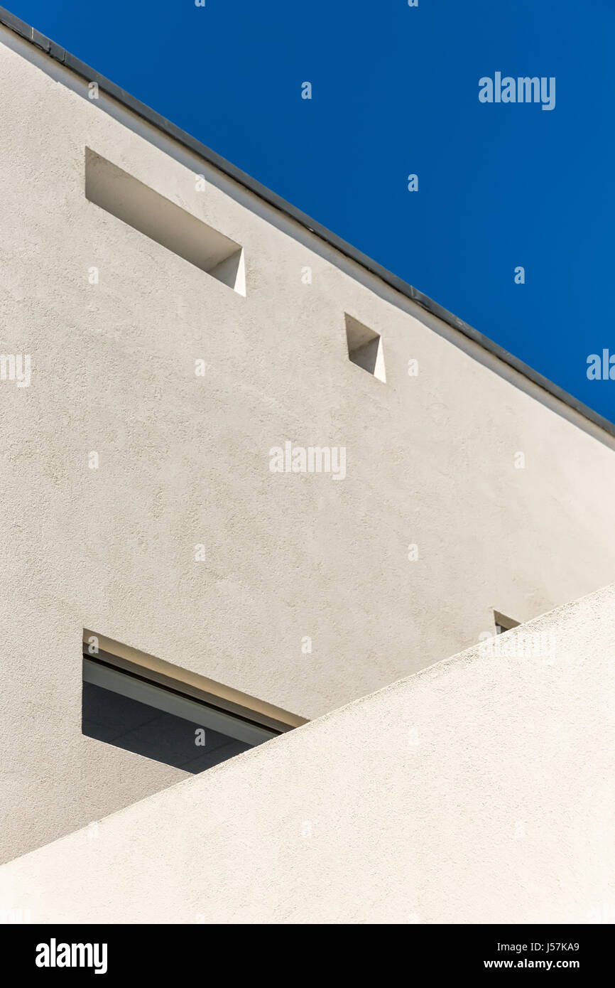 Striking Architectural Corner detail of modern white rendered building ...