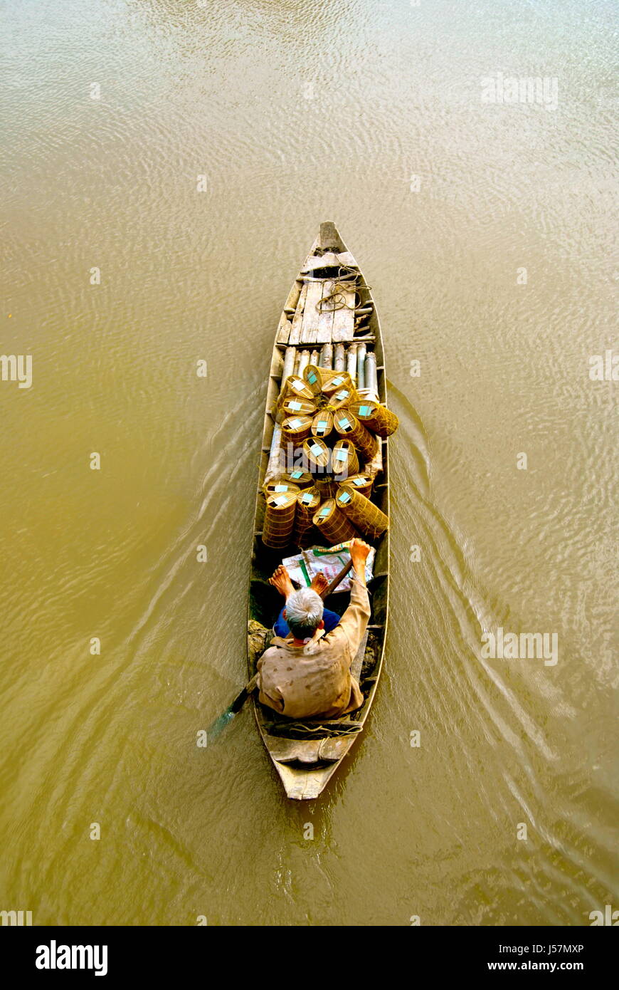 Elderly man transporting goods, Can Tho, Mekong Delta, Vietnam Stock Photo