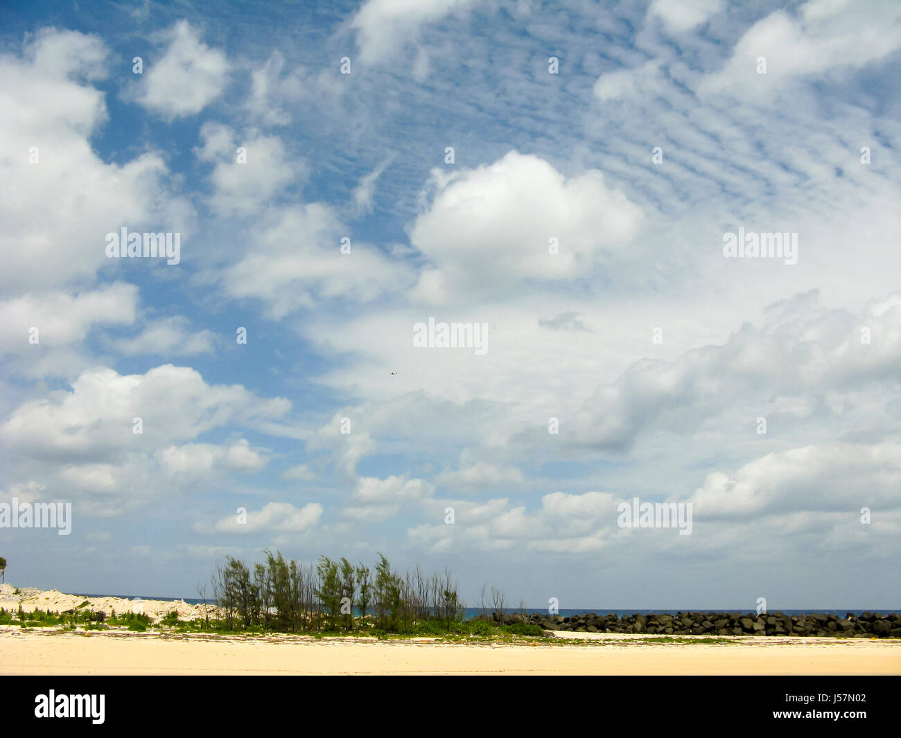 White clouds on the blue sky over country beach Stock Photo - Alamy