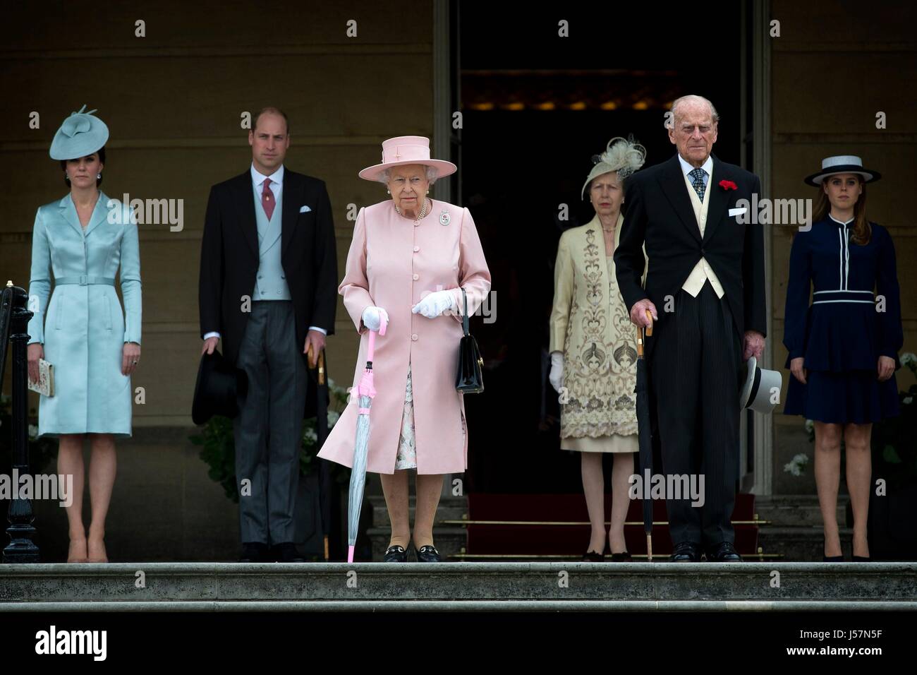 (left to right) The Duchess of Cambridge, the Duke of Cambridge, Queen Elizabeth II, the Princess Royal, the Duke of Edinburgh and Princess Beatrice at a garden party at Buckingham Palace in London. Stock Photo