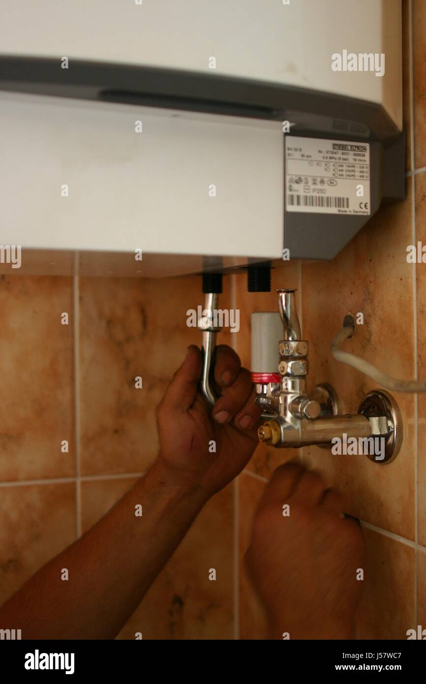 the installation of a water boiler Stock Photo Alamy