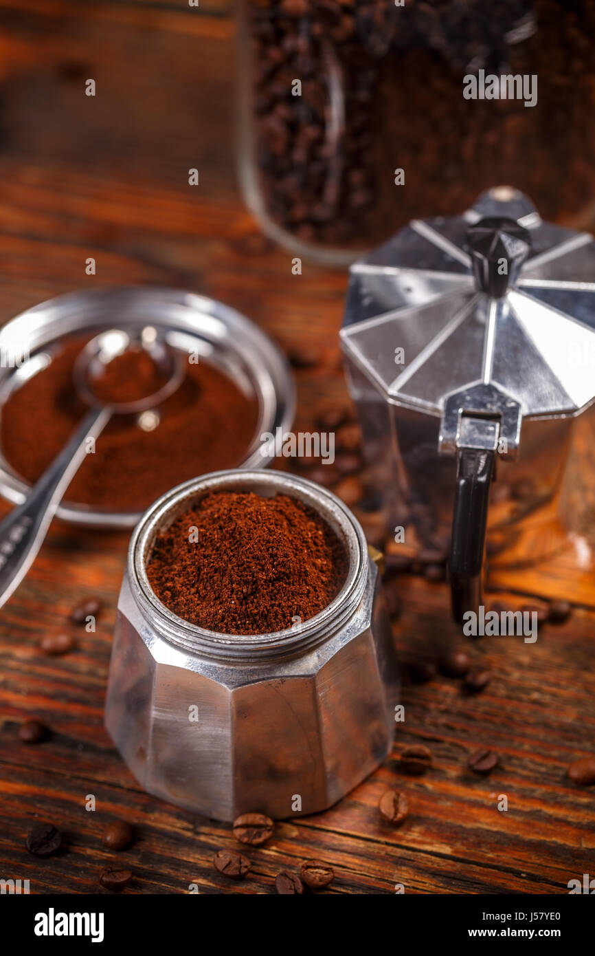 https://c8.alamy.com/comp/J57YE0/old-coffee-maker-in-vintage-style-on-wooden-background-J57YE0.jpg