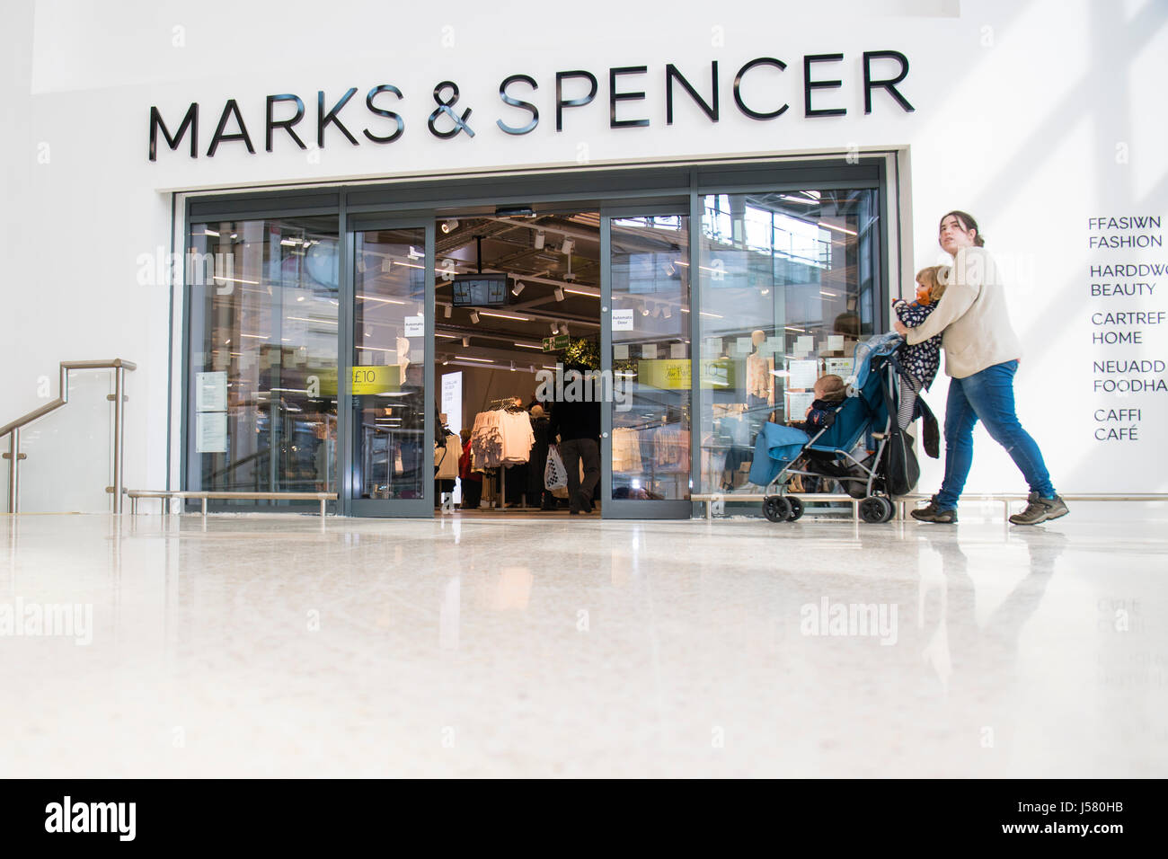 People going in through the main entrance of the  M&S Marks and Spencer store, Aberystwyth Wales UK Stock Photo
