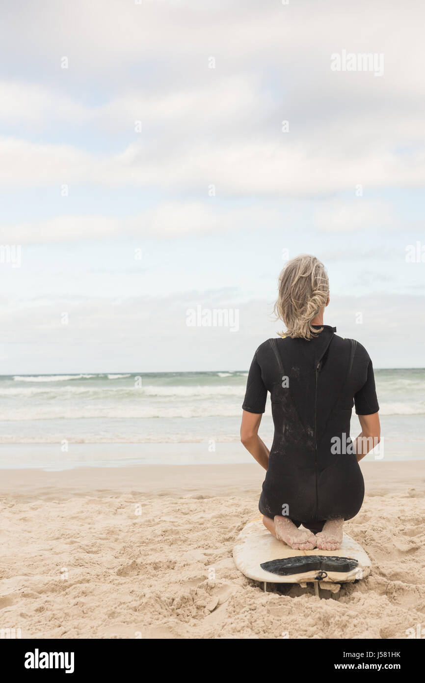 Woman kneeling water hi-res stock photography and images - Alamy