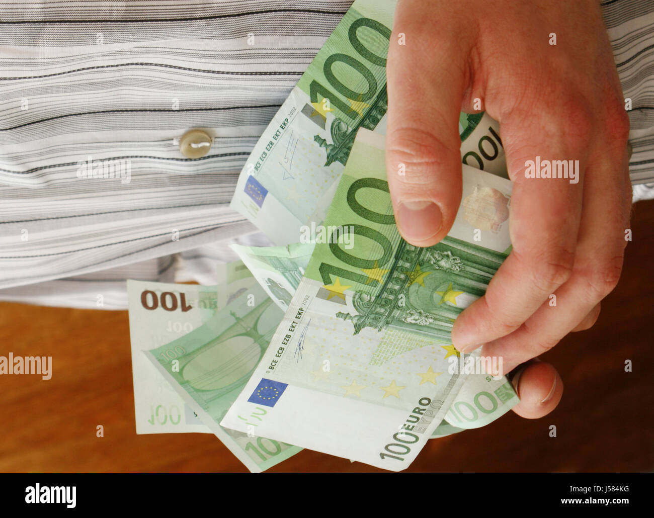 hand hands euro save rich wealthy well off bank notes tickets sweepstakes Stock Photo